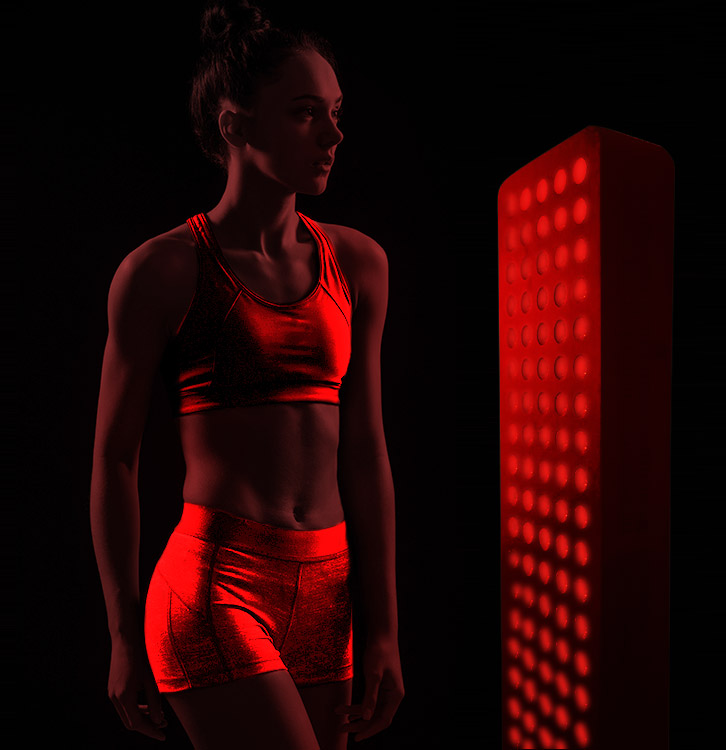 woman getting benefits from full body red light therapy
